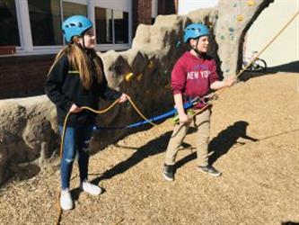 Climbing Wall Adventure - two students ready to climb
